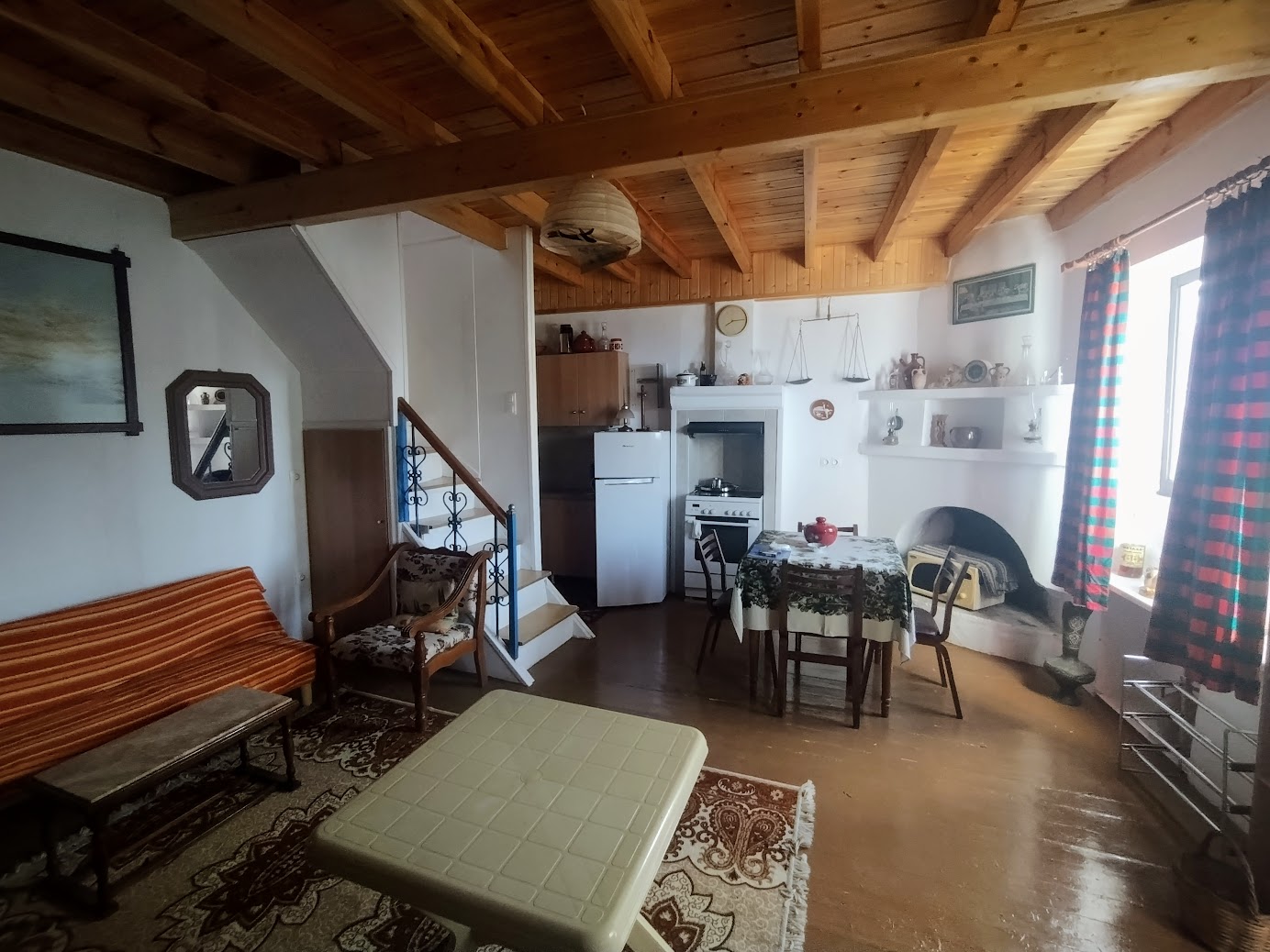 Cozy living area with kitchen in Ampelos village house